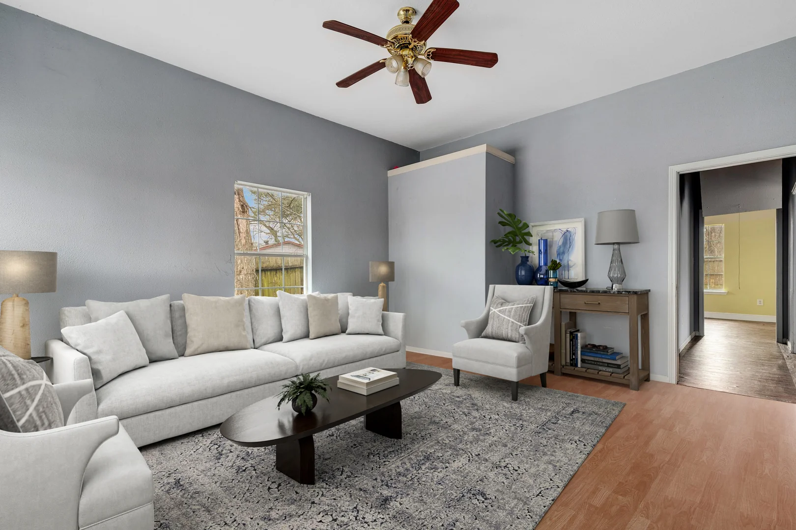 Living room ceiling fan and interior baseline condition at 7101 Wendemere St